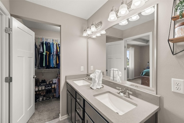 2718 NW 23rd St, Ankeny, IA 50023 - bathroom featuring double vanity and a walk in closet