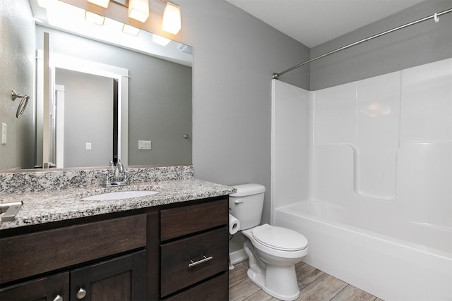 2017 NE Heritage Dr, Grimes, IA 50111 - full bathroom with vanity, wood finished floors, and shower / washtub combination