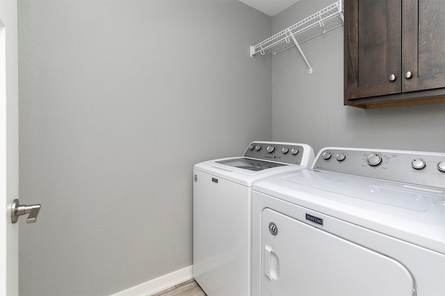 2017 NE Heritage Dr, Grimes, IA 50111 - laundry room featuring washing machine and clothes dryer and cabinet space