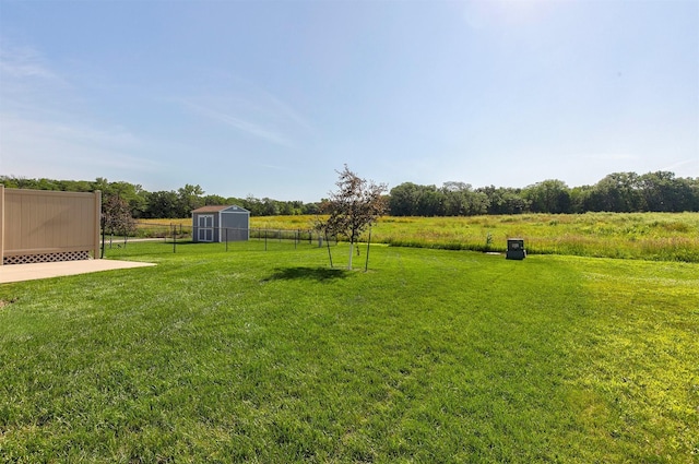 2017 NE Heritage Dr, Grimes, IA 50111 - view of yard with a storage unit and a view of countryside