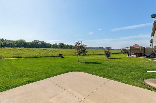 2017 NE Heritage Dr, Grimes, IA 50111 - view of green lawn featuring a gazebo and a patio area