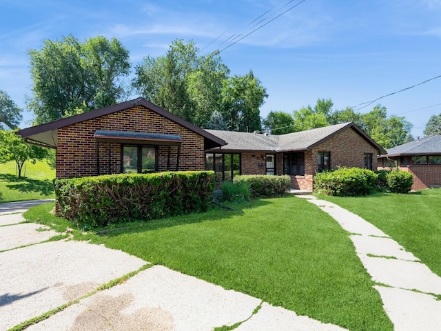 1509 Del Matro Ct, Windsor Heights, IA 50324 - ranch-style house with brick siding and a front lawn