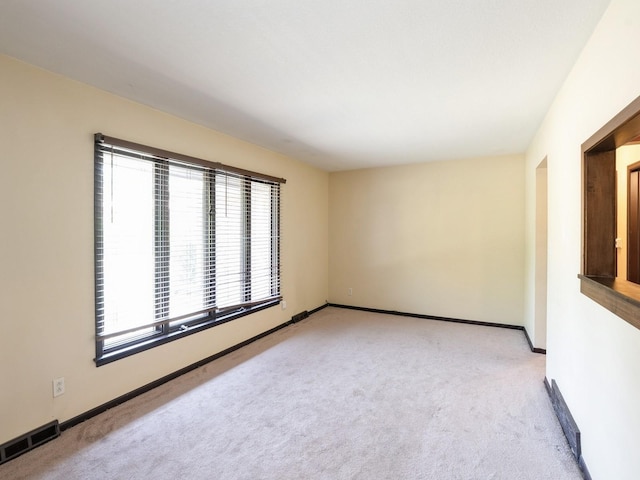 1509 Del Matro Ct, Windsor Heights, IA 50324 - unfurnished room featuring light carpet and baseboards