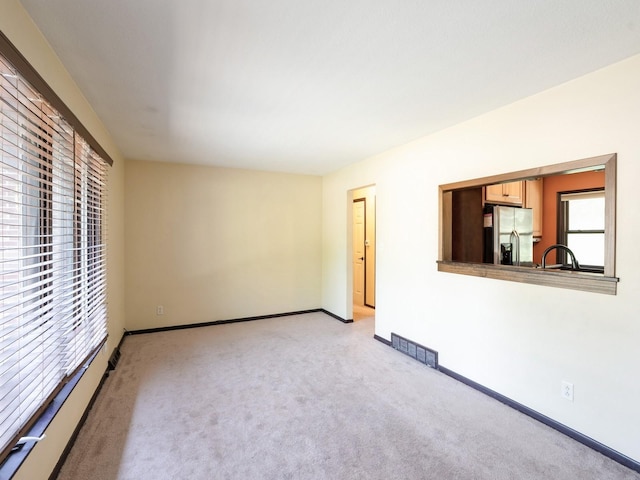 1509 Del Matro Ct, Windsor Heights, IA 50324 - unfurnished room with light carpet and baseboards