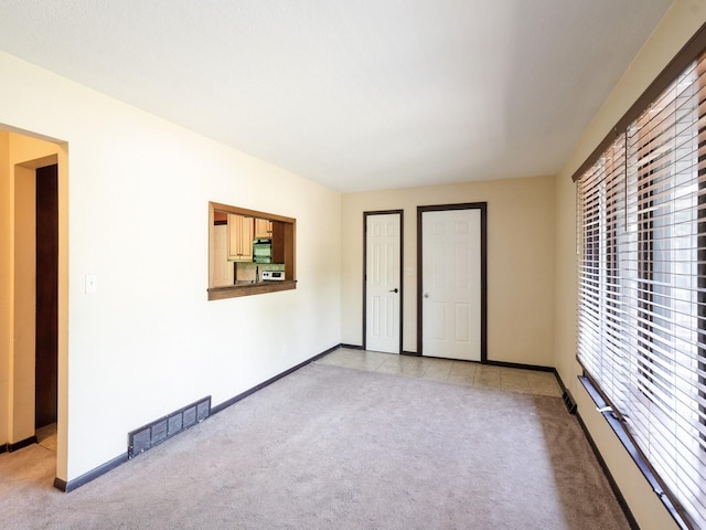 1509 Del Matro Ct, Windsor Heights, IA 50324 - empty room featuring light colored carpet and baseboards