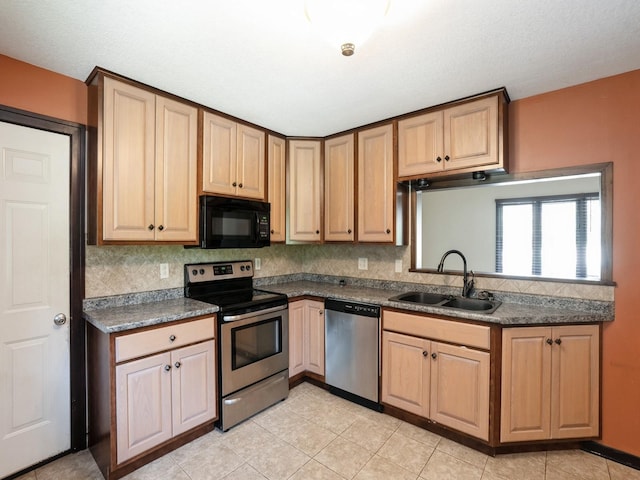 1509 Del Matro Ct, Windsor Heights, IA 50324 - kitchen featuring stainless steel appliances, decorative backsplash, dark countertops, light tile patterned floors, and light brown cabinets