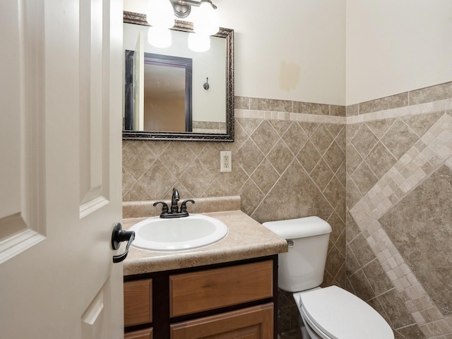 1509 Del Matro Ct, Windsor Heights, IA 50324 - bathroom featuring vanity and tile walls