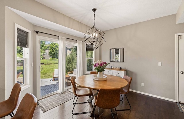 145 SE Kellerman Ln, Waukee, IA 50263 - dining area featuring a chandelier and dark wood finished floors