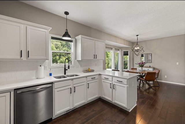 145 SE Kellerman Ln, Waukee, IA 50263 - kitchen featuring stainless steel dishwasher, dark wood-type flooring, white cabinets, decorative backsplash, and a textured ceiling