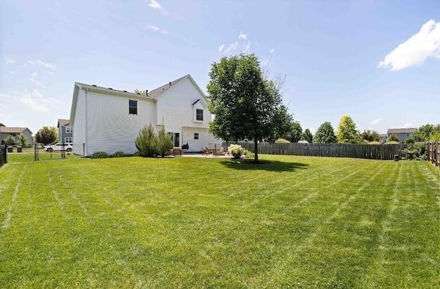 145 SE Kellerman Ln, Waukee, IA 50263 - fenced backyard featuring a patio