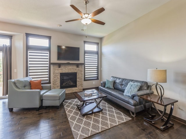 8955 Jamison Dr, West Des Moines, IA 50266 - living room featuring wood-type flooring, a stone fireplace, and a ceiling fan