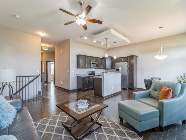 8955 Jamison Dr, West Des Moines, IA 50266 - living area featuring dark wood finished floors, ceiling fan, and recessed lighting