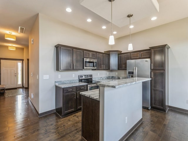 8955 Jamison Dr, West Des Moines, IA 50266 - kitchen with stainless steel appliances, dark brown cabinets, dark wood-type flooring, hanging light fixtures, and recessed lighting