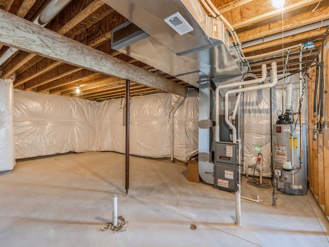 8955 Jamison Dr, West Des Moines, IA 50266 - unfinished basement featuring gas water heater and heating unit