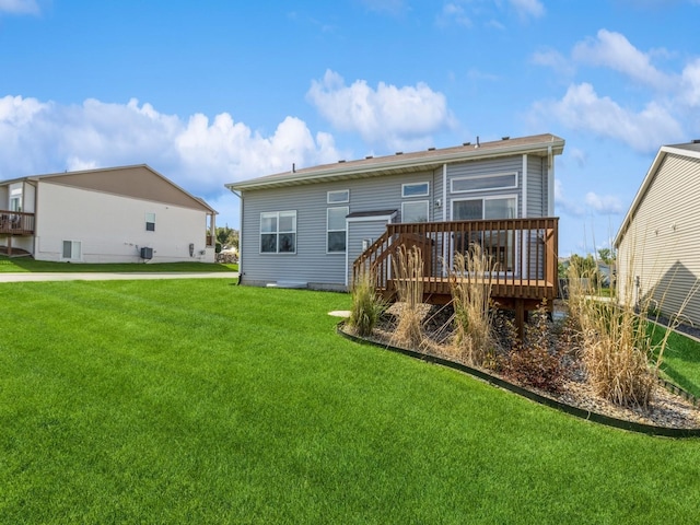 8955 Jamison Dr, West Des Moines, IA 50266 - back of house with a wooden deck and a yard