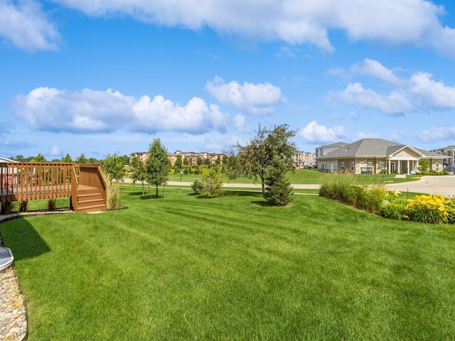 8955 Jamison Dr, West Des Moines, IA 50266 - view of green lawn with a wooden deck