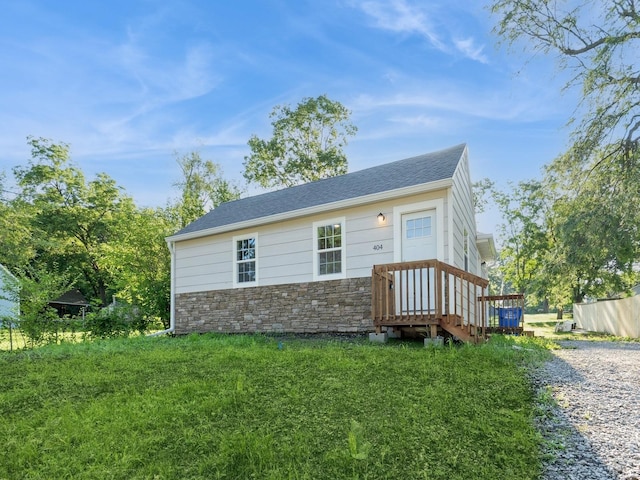 404 S B St, Indianola, IA 50125 - view of front of house with stone siding and roof with shingles