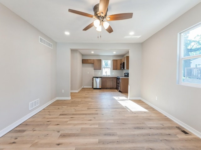 404 S B St, Indianola, IA 50125 - unfurnished living room with recessed lighting, a ceiling fan, and light wood-type flooring