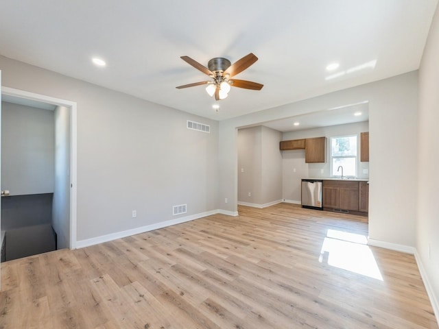 404 S B St, Indianola, IA 50125 - unfurnished living room with ceiling fan, recessed lighting, and light wood finished floors