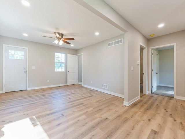 404 S B St, Indianola, IA 50125 - unfurnished living room featuring a ceiling fan, recessed lighting, and light wood-type flooring