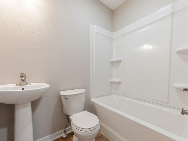404 S B St, Indianola, IA 50125 - bathroom with  shower combination and wood finished floors
