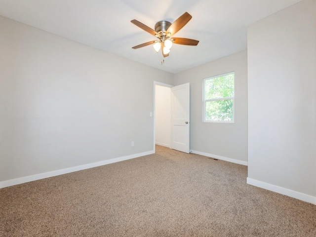 404 S B St, Indianola, IA 50125 - spare room with light colored carpet and a ceiling fan
