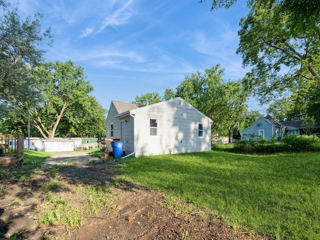404 S B St, Indianola, IA 50125 - rear view of house featuring a lawn