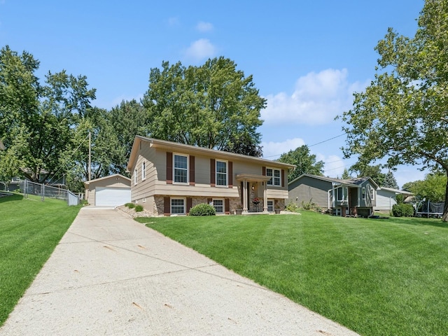 4408 66th St, Urbandale, IA 50322 - split foyer home featuring an outbuilding, brick siding, and a garage