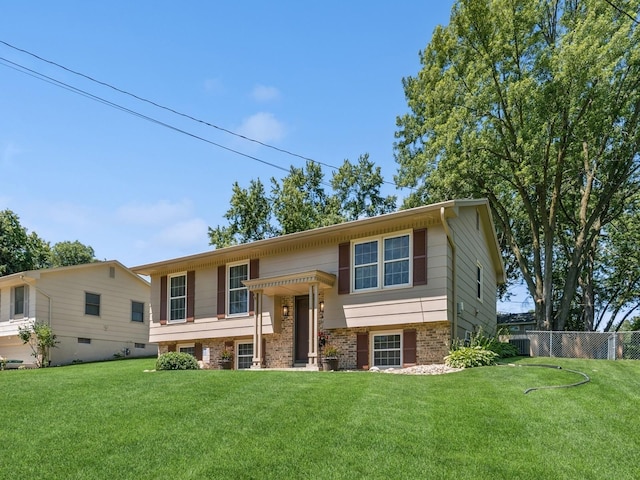 4408 66th St, Urbandale, IA 50322 - raised ranch featuring brick siding