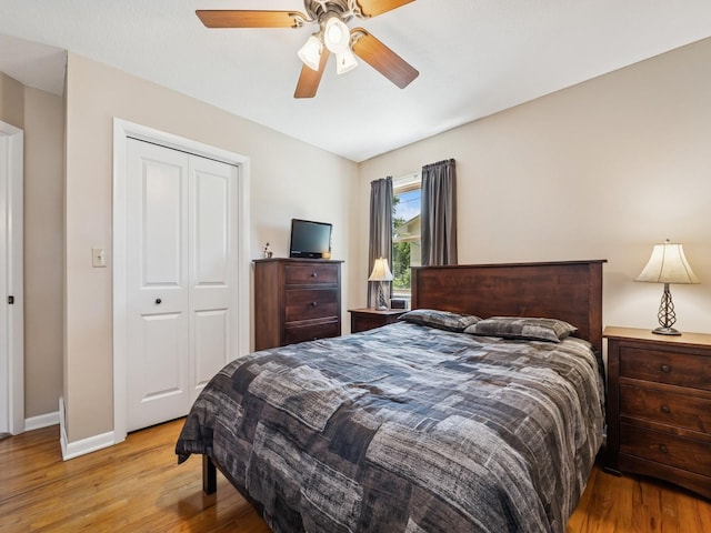 4408 66th St, Urbandale, IA 50322 - bedroom featuring wood finished floors, a closet, and a ceiling fan