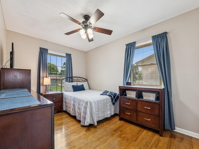 4408 66th St, Urbandale, IA 50322 - bedroom with light wood-style flooring and ceiling fan
