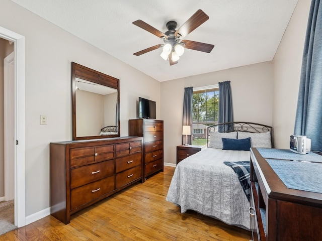 4408 66th St, Urbandale, IA 50322 - bedroom with light wood-type flooring and a ceiling fan