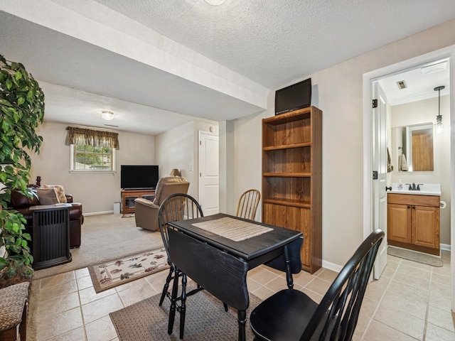 4408 66th St, Urbandale, IA 50322 - dining space featuring a textured ceiling and light colored carpet