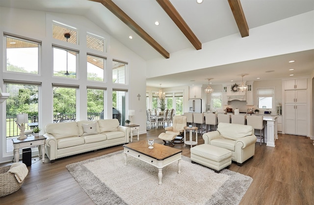 11174 NW 108th Ct, Granger, IA 50109 - living room with a chandelier, recessed lighting, beam ceiling, wood finished floors, and high vaulted ceiling