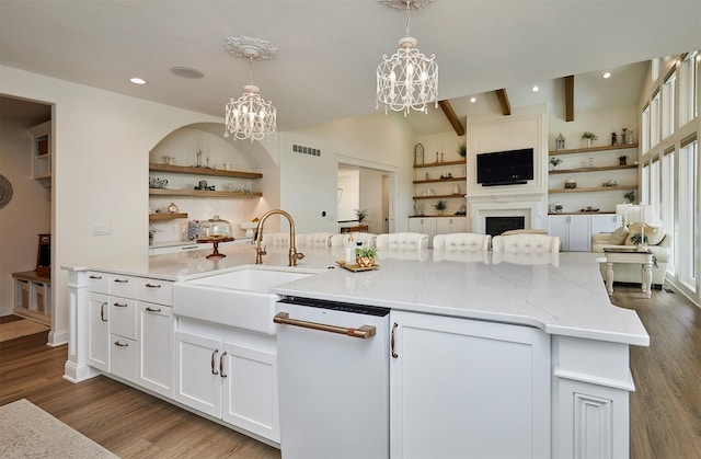 11174 NW 108th Ct, Granger, IA 50109 - kitchen featuring dishwasher, open floor plan, a chandelier, white cabinetry, and light stone counters