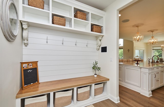 11174 NW 108th Ct, Granger, IA 50109 - mudroom featuring dark wood-type flooring and a chandelier