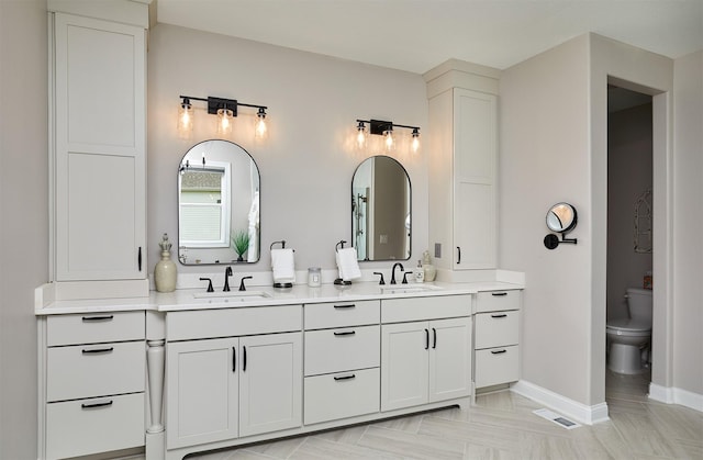 11174 NW 108th Ct, Granger, IA 50109 - bathroom featuring double vanity and toilet