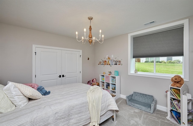 11174 NW 108th Ct, Granger, IA 50109 - carpeted bedroom featuring a chandelier and a closet