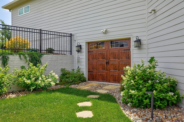 11174 NW 108th Ct, Granger, IA 50109 - doorway to property featuring a garage