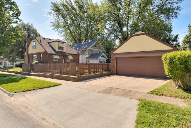 2220 York St, Des Moines, IA 50316 - view of front of house featuring a chimney, brick siding, and a garage