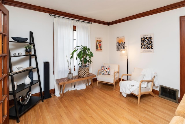 2220 York St, Des Moines, IA 50316 - living area featuring ornamental molding and light wood-type flooring
