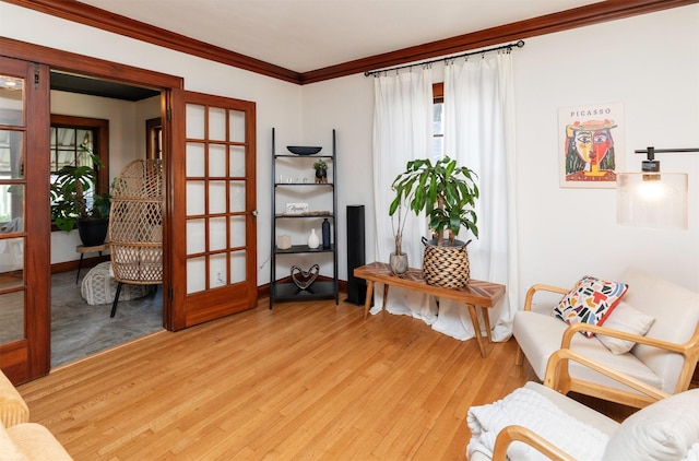 2220 York St, Des Moines, IA 50316 - living area featuring crown molding, light wood-type flooring, and french doors