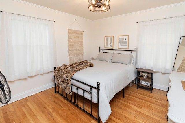2220 York St, Des Moines, IA 50316 - bedroom with wood finished floors and ornamental molding