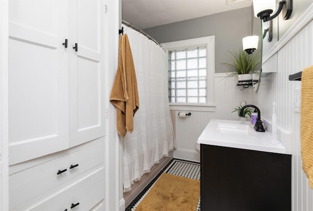 2220 York St, Des Moines, IA 50316 - bathroom with vanity and wainscoting