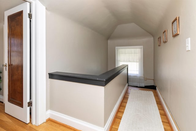2220 York St, Des Moines, IA 50316 - corridor with light wood finished floors, an upstairs landing, and vaulted ceiling