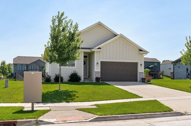 2845 SE Bluestem Dr, Waukee, IA 50263 - view of front of property with an attached garage, board and batten siding, driveway, a front yard, and stone siding