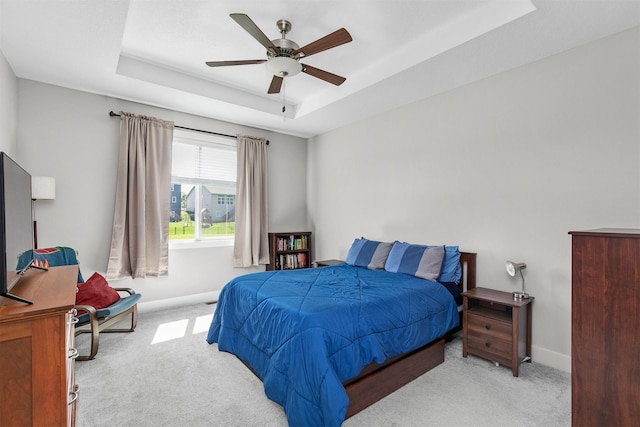 2845 SE Bluestem Dr, Waukee, IA 50263 - bedroom with carpet, a raised ceiling, and a ceiling fan