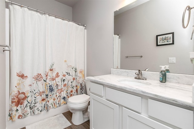 2845 SE Bluestem Dr, Waukee, IA 50263 - full bath featuring vanity, wood finished floors, and a shower with curtain