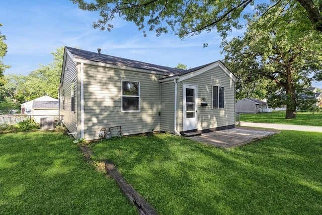 3901 Lawnwoods Dr, Des Moines, IA 50310 - back of house featuring a yard and a patio area