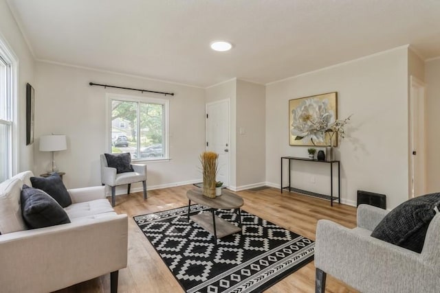 3901 Lawnwoods Dr, Des Moines, IA 50310 - living room with light wood finished floors and crown molding